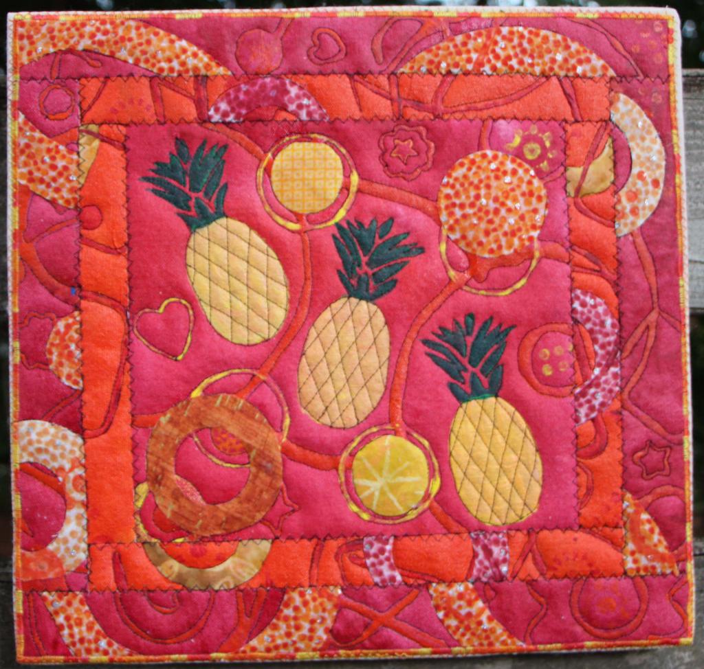 Tumbling Pineapples on red with orange