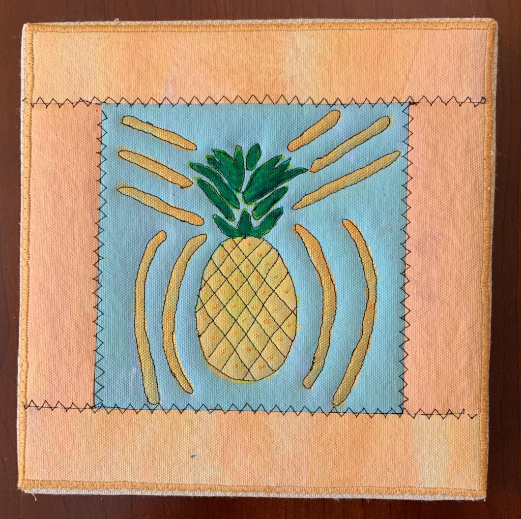 Pineapple with gold accents on blue with peach border